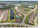 Scenic aerial view highlighting the community's layout, featuring ponds, a pool, and tennis courts, creating an active lifestyle at 8725 Amaretto Ave, Sarasota, FL 34238
