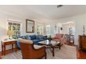 Inviting living room filled with natural light, showcasing hardwood floors and a seamless flow to the dining area at 114 Mcgregor St, Punta Gorda, FL 33950