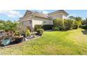 Manicured lawn and landscaping add curb appeal to this lovely single-Gathering home at 1230 Collier Pl, Venice, FL 34293