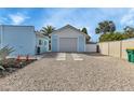 Detached one car garage with light-blue siding, a concrete paver walkway, and a gravel driveway at 3215 Cedarbrook Dr, Punta Gorda, FL 33982
