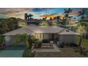 Beautiful single-story home with well-manicured lawn, mature palms and metal roof at 3824 Aves Island Ct, Punta Gorda, FL 33950