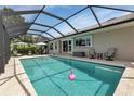 Inviting screened-in pool area perfect for relaxing and entertaining with ample seating at 859 Napoli Ln, Punta Gorda, FL 33950