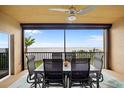 Balcony with dining table and chairs overlooking the ocean at 93 Vivante Blvd # 9344, Punta Gorda, FL 33950