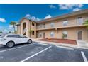Exterior of a condo building featuring covered stairwells, balconies, and assigned parking spaces at 175 Kings Hwy # B2 1522, Punta Gorda, FL 33983