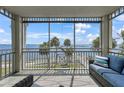 Enjoy beautiful views from this screened in balcony with comfortable seating, perfect for relaxation at 5114 Melbourne St # A202, Punta Gorda, FL 33980