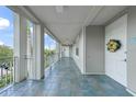 Inviting outdoor entryway with blue tile floors and decorative details, showcasing unit 120 at 5114 Melbourne St # A202, Punta Gorda, FL 33980