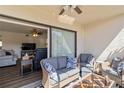 Relaxing screened lanai with comfortable seating, ceiling fan, and view to the interior at 5416 Swift Rd # 27, Sarasota, FL 34231