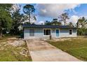 Attractive single-story home showcasing a well-maintained lawn and convenient driveway at 6329 David Blvd, Port Charlotte, FL 33981