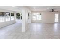 Open living area with recessed lighting, ceiling fan, and tile flooring, full of natural light at 182 Dowling Ne Ave, Port Charlotte, FL 33952