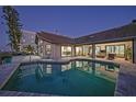 Private pool and patio area, perfect for outdoor entertaining with tranquil waterfront views at twilight at 1820 Jamaica Way, Punta Gorda, FL 33950