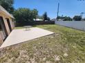 Expansive backyard features a patio area, perfect for outdoor entertaining and relaxation at 2306 Lee Ter, Port Charlotte, FL 33952