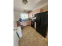 Functional kitchen with essential appliances at 2306 Lee Ter, Port Charlotte, FL 33952