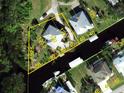 Beautiful aerial view of the property with waterfront access and lush greenery at 3712 Balboa Ct, Punta Gorda, FL 33983