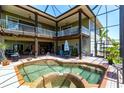 Stunning outdoor living space with a beautiful pool and covered patio at 3712 Balboa Ct, Punta Gorda, FL 33983