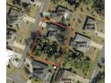 Aerial view of property boundaries in a residential neighborhood with mature trees at 5640 Burdette Ter, North Port, FL 34287