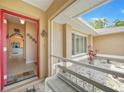 Inviting home foyer with tiled floor, bench, and a glimpse of the interior layout at 657 Hartford Nw Dr, Port Charlotte, FL 33952