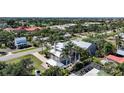 Aerial view of neighborhood with lush greenery and sidewalks at 740 W Virginia Ave, Punta Gorda, FL 33950