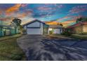Charming single-Gathering home with a well-maintained lawn and a spacious driveway leading to a two-car garage at 125 Donna Ct, Punta Gorda, FL 33950