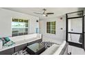Spacious screened-in patio with comfortable seating and ceiling fan at 14224 Heritage Landing Blvd # 923, Punta Gorda, FL 33955