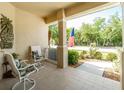 Comfortable front porch with seating, showcasing a relaxing outdoor living space at 1991 Mossy Oak Dr, North Port, FL 34287