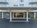 Inviting Harbour House entrance with a covered porte-cochere and manicured landscaping at 2401 Bayshore Blvd # 1204, Tampa, FL 33629