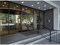 Glass doors at the building entrance, featuring a sleek design and signage at 2401 Bayshore Blvd # 1204, Tampa, FL 33629