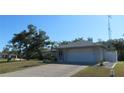 Lovely single-story home with a well-manicured lawn and a convenient two-car garage at 296 Milford St, Port Charlotte, FL 33953