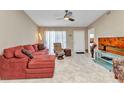 Inviting living room featuring a comfortable sectional sofa and neutral color palette at 3300 Loveland Blvd # 2801, Punta Gorda, FL 33980
