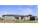 A beautifully renovated single-story home featuring a bright exterior and dark trim at 3315 Elkcam Blvd, Port Charlotte, FL 33952