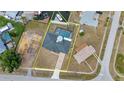 Aerial view of property showing the house, pool, and waterfront location with boat dock at 4213 Gardner Dr, Port Charlotte, FL 33952