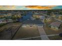 Gorgeous aerial view of a waterfront property with serene canal access and stunning sunset sky at 4213 Gardner Dr, Port Charlotte, FL 33952