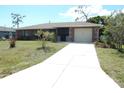 Inviting single-Gathering home with a spacious driveway and attached one car garage at 582 Reading Nw St, Port Charlotte, FL 33952