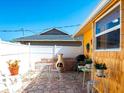 Cozy outdoor paver patio area with room for dining and grilling perfect for enjoying the fresh air at 582 Ridgewood Nw St, Port Charlotte, FL 33952