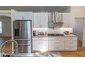 A closer view of the modern, stainless steel appliances in the well-lit kitchen at 6308 Grove Blvd, Punta Gorda, FL 33982