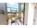 Bright foyer with tiled floor, screened doorway, and white walls at 10203 Windsong Rd, Punta Gorda, FL 33955