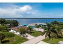 Waterfront property offering picturesque views, lush greenery, and boat dockage in a serene neighborhood at 12420 Minot Ave, Port Charlotte, FL 33981