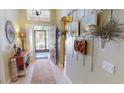 Welcoming foyer with decorative accents and views of the front door and hallway at 1677 Palace Ct, Punta Gorda, FL 33980