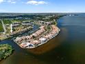 Beautiful aerial view of waterfront condos with private docks and serene bay views on a sunny day at 25188 Marion Ave # 1038, Punta Gorda, FL 33950