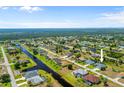 A peaceful community with tree-lined streets and canal frontage, providing a serene and desirable location at 265 White Marsh Ln, Rotonda West, FL 33947