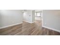 Spacious living room featuring gorgeous new floors, neutral wall colors, and an open-concept floorplan at 31 Oberlin Rd, Venice, FL 34293