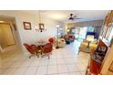 Bright living room featuring tiled floors, waterfront views, and comfortable seating at 311 Garvin St # 405A, Punta Gorda, FL 33950