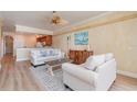 Living room showcasing neutral furniture, wood-look flooring, and serene decor at 3228 Purple Martin Dr # 116, Punta Gorda, FL 33950