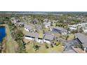 An aerial view of the condo community surrounded by lush greenery, waterways, and residential neighborhoods at 4260 Placida Rd # 13B, Englewood, FL 34224