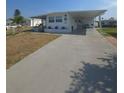 Charming single-story home with a covered carport and well-maintained landscaping at 517 Clarion Pl, North Port, FL 34287