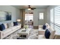 Comfortable living room with modern furniture, eye-catching rug, and elegant decor at 6272 Sooner St, North Port, FL 34287