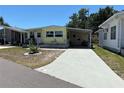 Charming single-story home with a covered carport and well-maintained landscaping at 805 S Green Cir, Venice, FL 34285