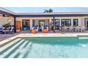 Stunning backyard featuring a large pool, outdoor seating, and a dining area for ultimate relaxation and entertainment at 810 Napoli Ln, Punta Gorda, FL 33950