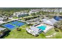 Community aerial featuring pool, tennis courts, and beautiful landscaping at 2061 Willow Hammock Cir # 303, Punta Gorda, FL 33983