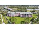 Beautifully maintained condo building with lush green lawn at 2061 Willow Hammock Cir # 303, Punta Gorda, FL 33983