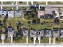 Aerial view of neighborhood showing the roof lines of the houses and their landscaping from directly overhead at 277 Long Meadow Ln, Rotonda West, FL 33947